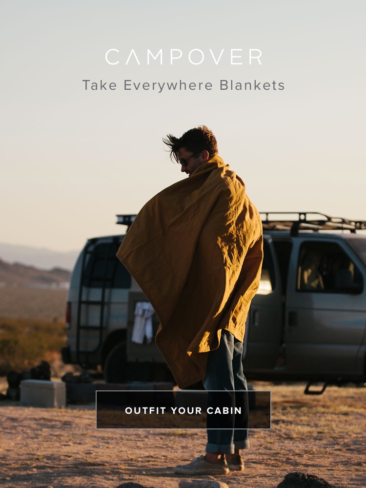 Staying warm with a Campover Blanket at Joshua Tree Campover Cabin in Joshua Tree, CA. Campover sells modern cabin supplies.